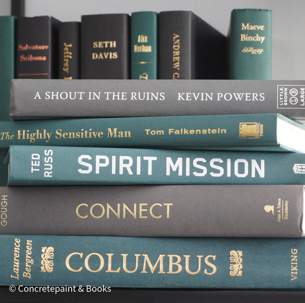 Green and gray books for decorating and reading. Modern masculine shelf décor. 