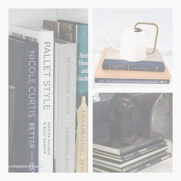 Sets of coffee table books. Black book stack used for decorating. Navy blue and golden book display with ikea watering can. Set of home decorating coffee table books on bookshelf.