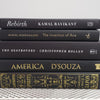 Stack of Black Books Gold & White Accent. Real hardcover books staged and used for decorating.