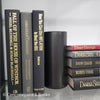 Book Stack Most Vintage & Bookend on glass shelf for display in home. Harcover books in black gray and red. Real books to read or decorate with. 