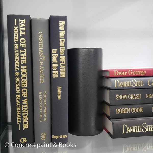 Book Stack Most Vintage & Bookend on glass shelf for display in home. Harcover books in black gray and red. Real books to read or decorate with. 