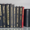 Book Stack Most Vintage & Bookend on glass shelf for display in home. Harcover books in black gray and red. Real books to read or decorate with. 