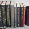 Book Stack Most Vintage & Bookend on glass shelf for display in home. Harcover books in black gray and red. Real books to read or decorate with. 