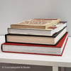 Stack of real books staged for display. Large and small books used for decorating. 