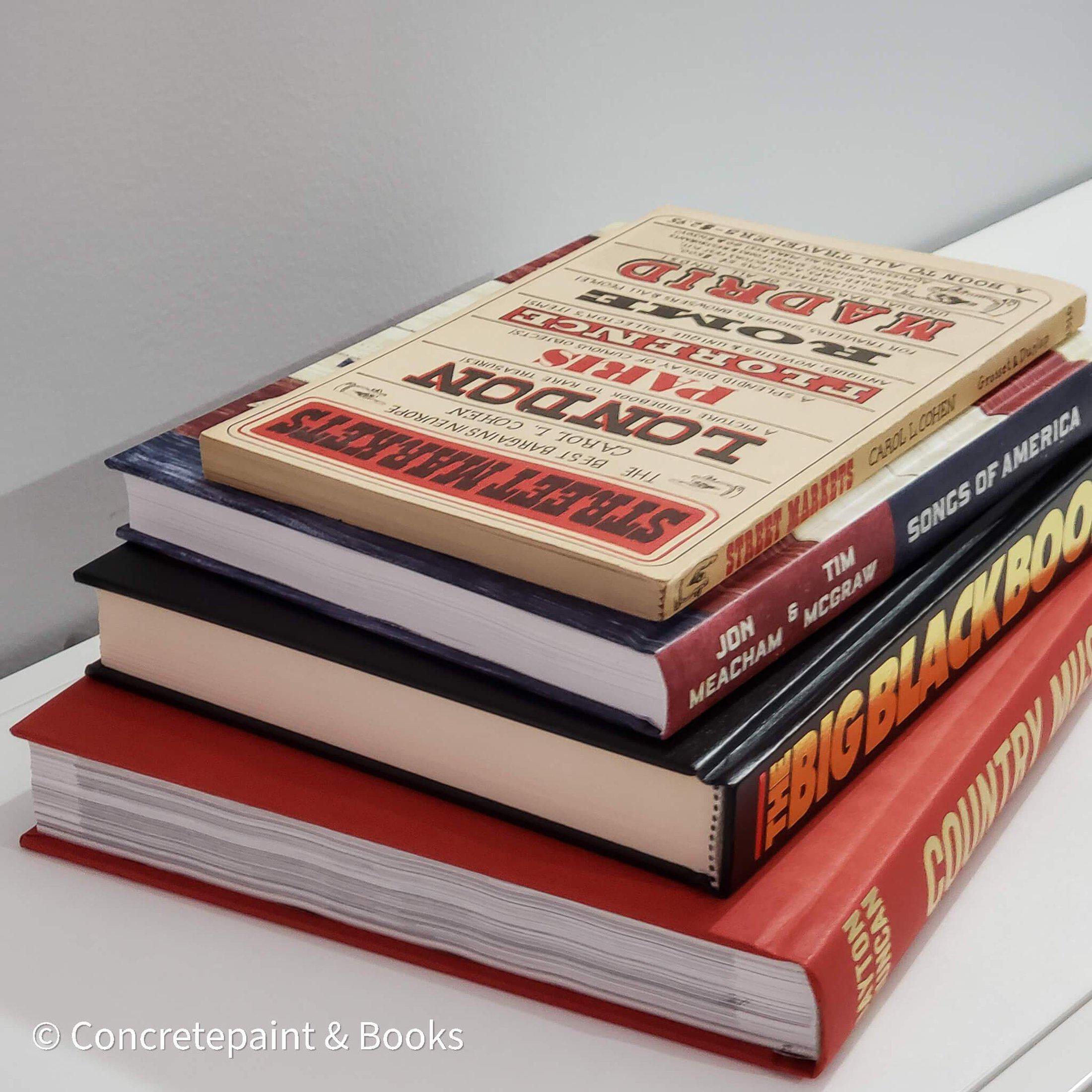 Stack of real books staged for display. Large and small books used for decorating. 