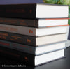 Gray and black books on diplay for mens home decor. 