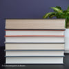 Gray and black books on diplay for mens home decor. 