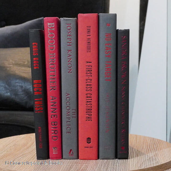 Black, gray, and red books for display. 