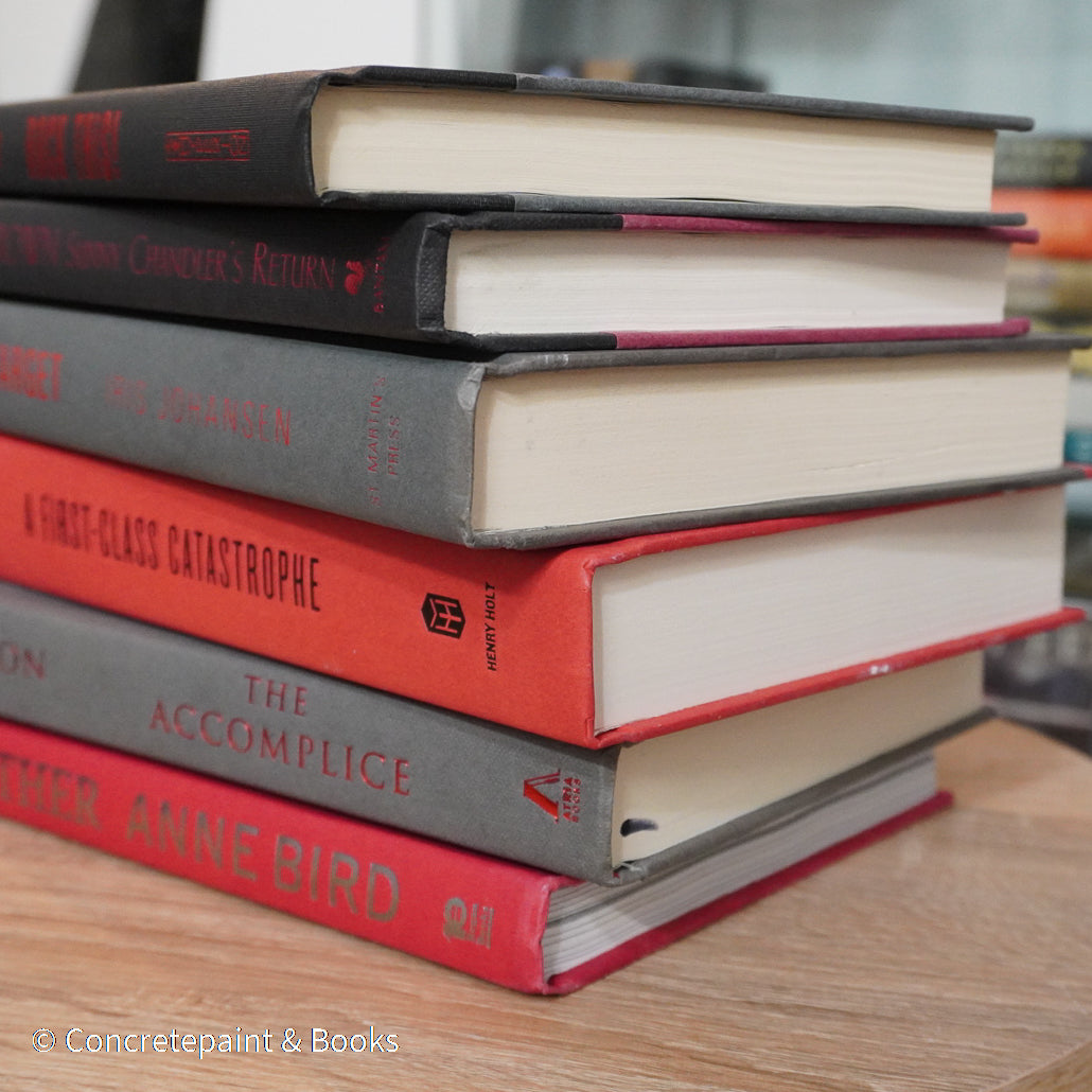 Black, gray, and red books for display. 