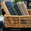 Neutral, mint, and navy color books used for decorating. Stack of real hardcover books for display. 