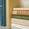 Olive green and neutral books used as shelf decor. Set of books for reading and decorating.