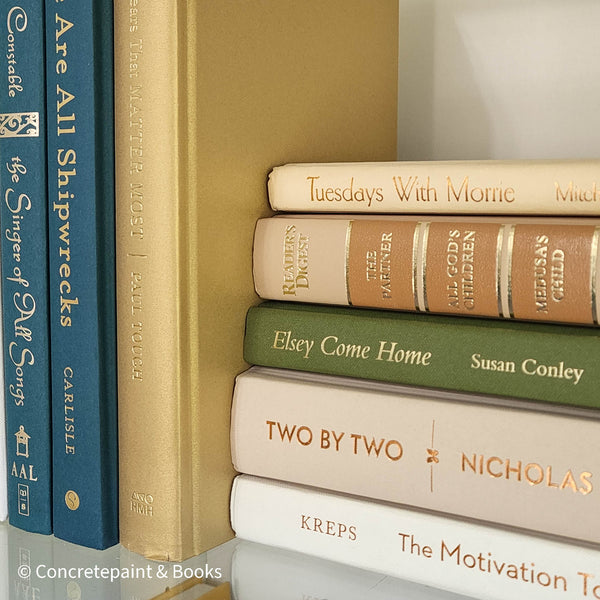 Olive green and neutral books used as shelf decor. Set of books for reading and decorating.