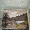 Real headcover books used as staged home décor. Stack of large oblong coffee table books.