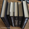 Stack of black decorative books for home decor.