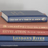 Navy blue and terra-cotta colored books. Decorative books for display. 