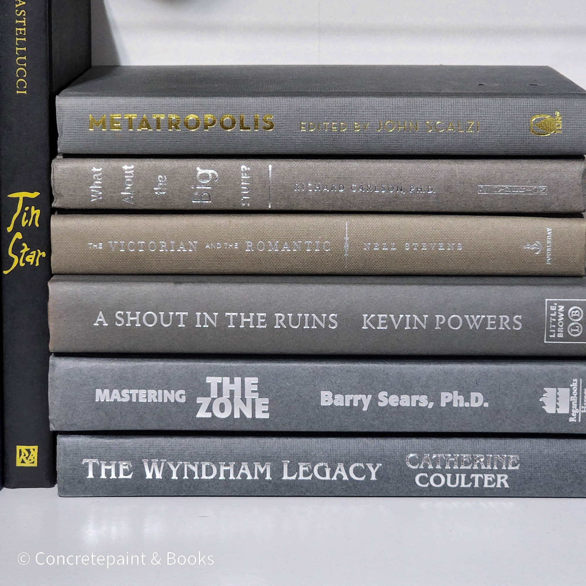 Set of used books with gray binding for home display and decoration.