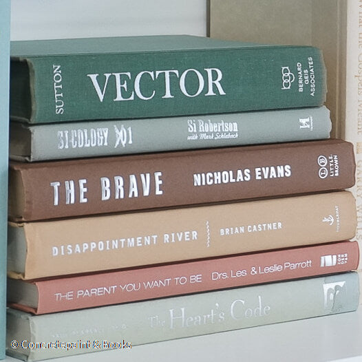 Green and brown books used for shelf decor. 