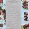 stack of cookbooks for decorating kitchen. White and blush kitchen decor. 