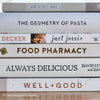 stack of cookbooks for decorating kitchen. White and blush kitchen decor. 