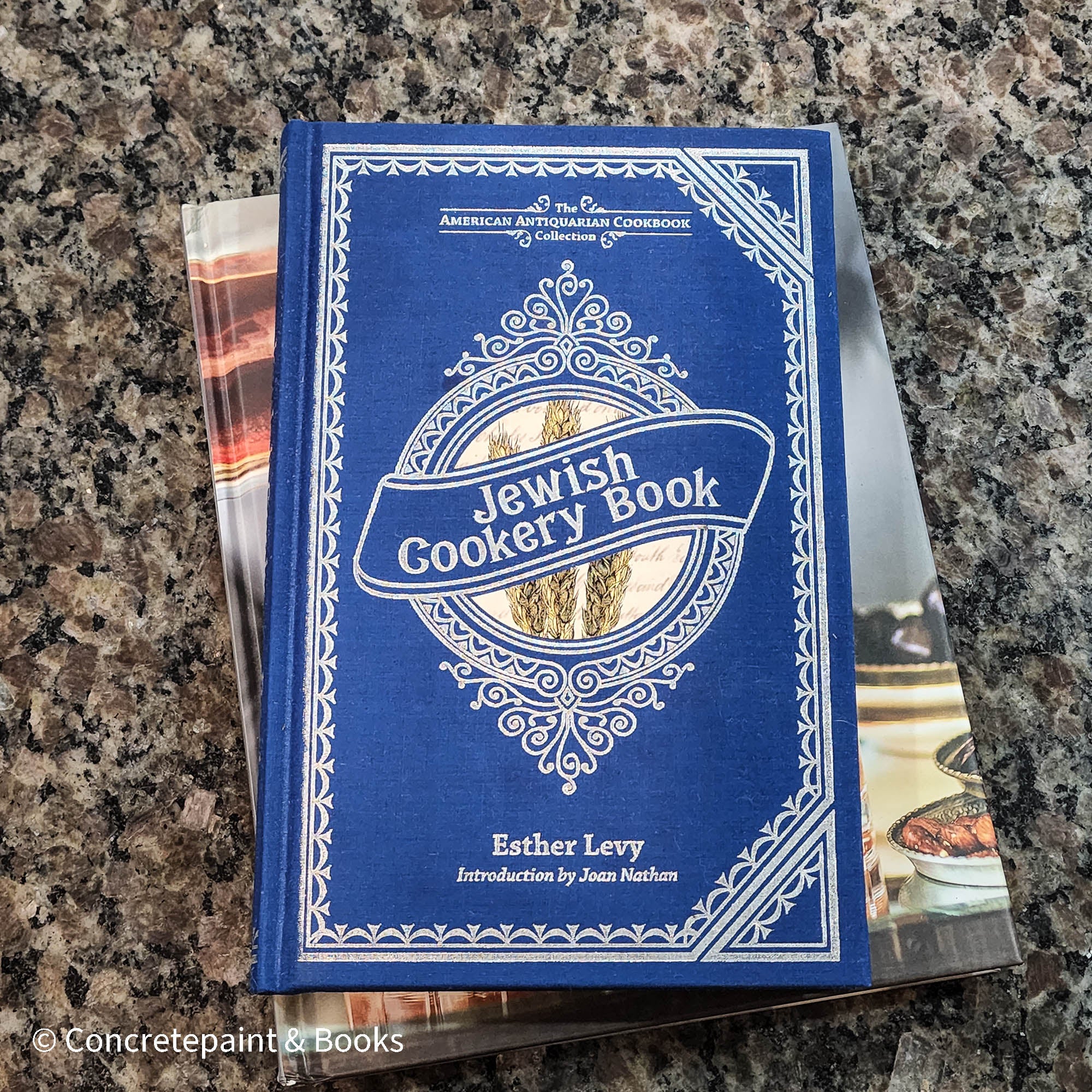 Diet and cookbooks for decoration and reading. Neutral, blue and gray kitchen or coffee table decoration.