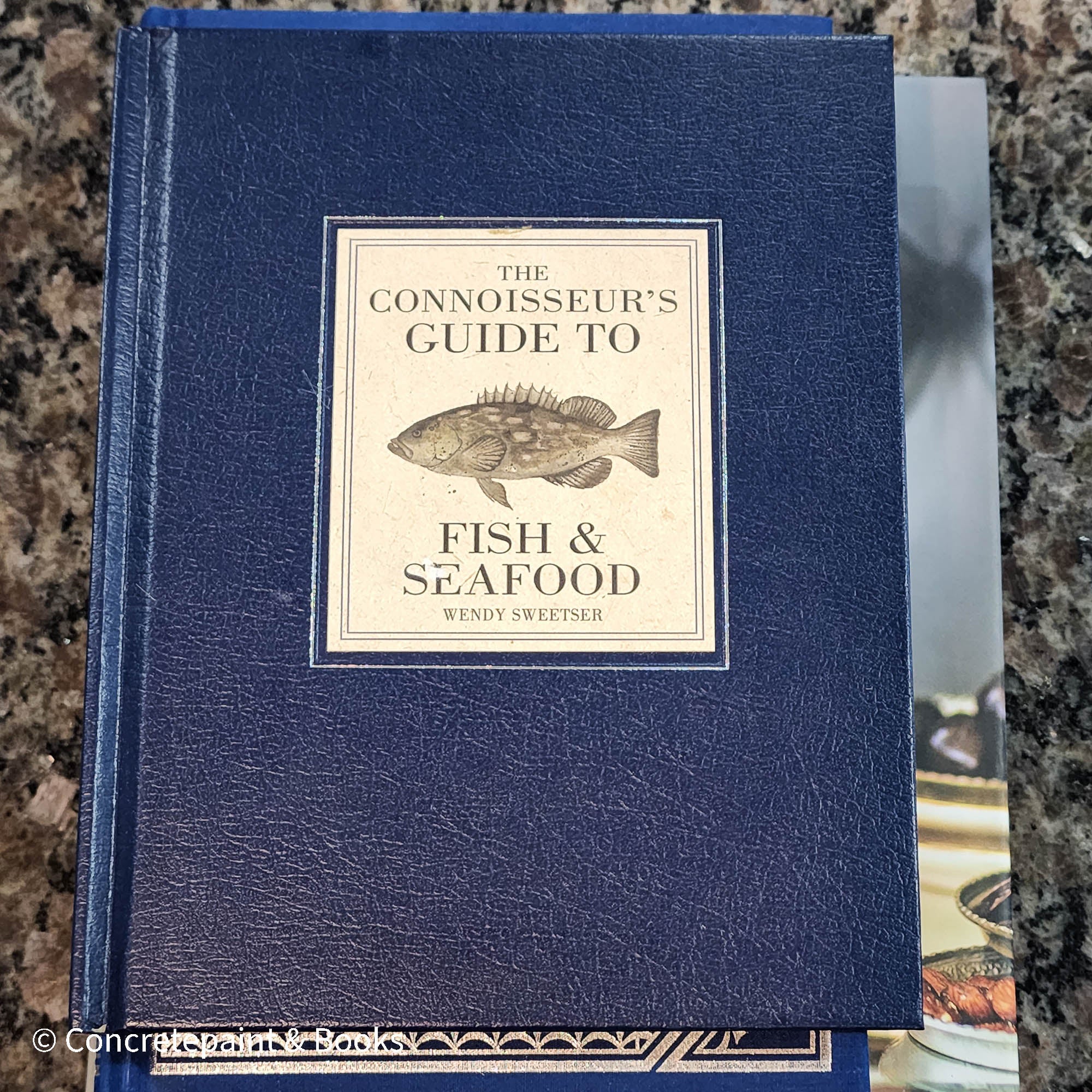 Diet and cookbooks for decoration and reading. Neutral, blue and gray kitchen or coffee table decoration.