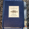 Diet and cookbooks for decoration and reading. Neutral, blue and gray kitchen or coffee table decoration.