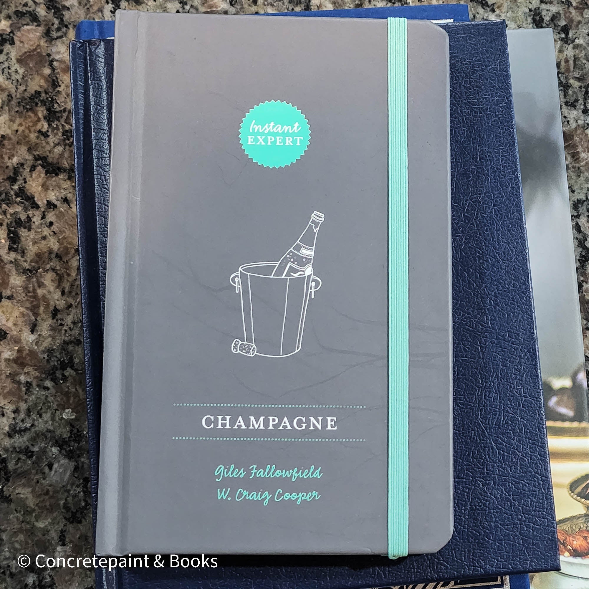 Diet and cookbooks for decoration and reading. Neutral, blue and gray kitchen or coffee table decoration.