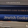 Diet and cookbooks for decoration and reading. Neutral, blue and gray kitchen or coffee table decoration.