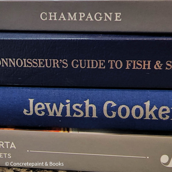 Diet and cookbooks for decoration and reading. Neutral, blue and gray kitchen or coffee table decoration.