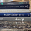 Diet and cookbooks for decoration and reading. Neutral, blue and gray kitchen or coffee table decoration.