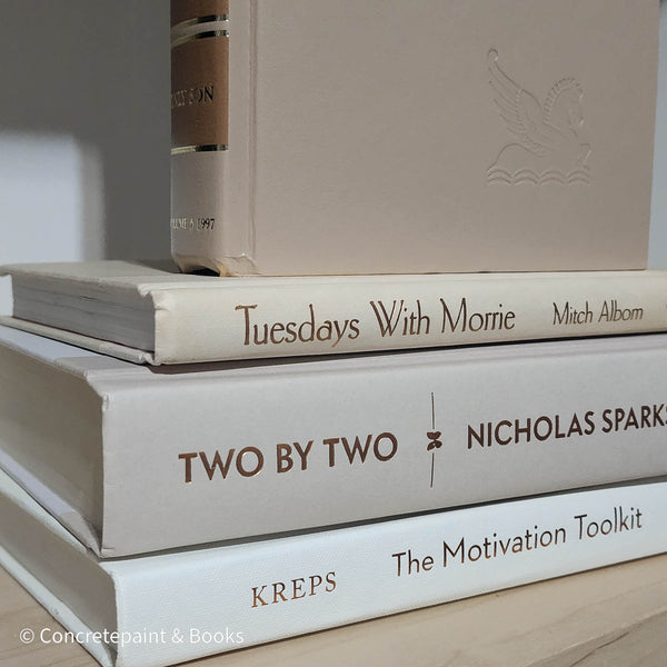 Olive green and neutral books used as shelf decor. Set of books for reading and decorating.