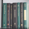 Set of green and black hardcover books used for decorating. Book desplay used for men's shelf decor.