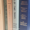 Neutral, mint, and navy color books used for decorating. Stack of real hardcover books for display. 