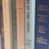 Neutral, mint, and navy color books used for decorating. Stack of real hardcover books for display. 