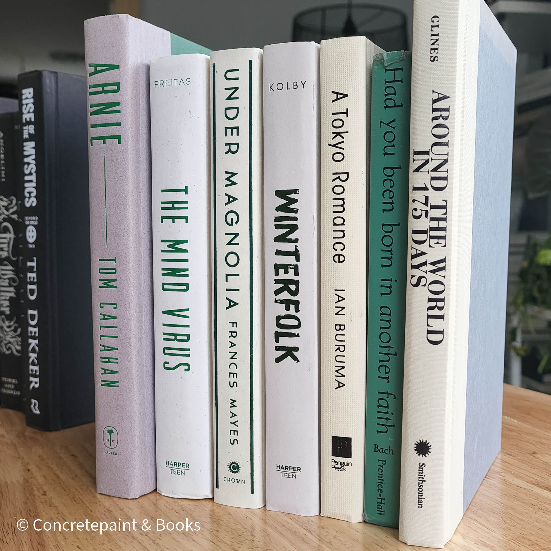 Green neutral and gray real hardcover book stack used for decoration.