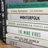 Green neutral and gray real hardcover book stack used for decoration.