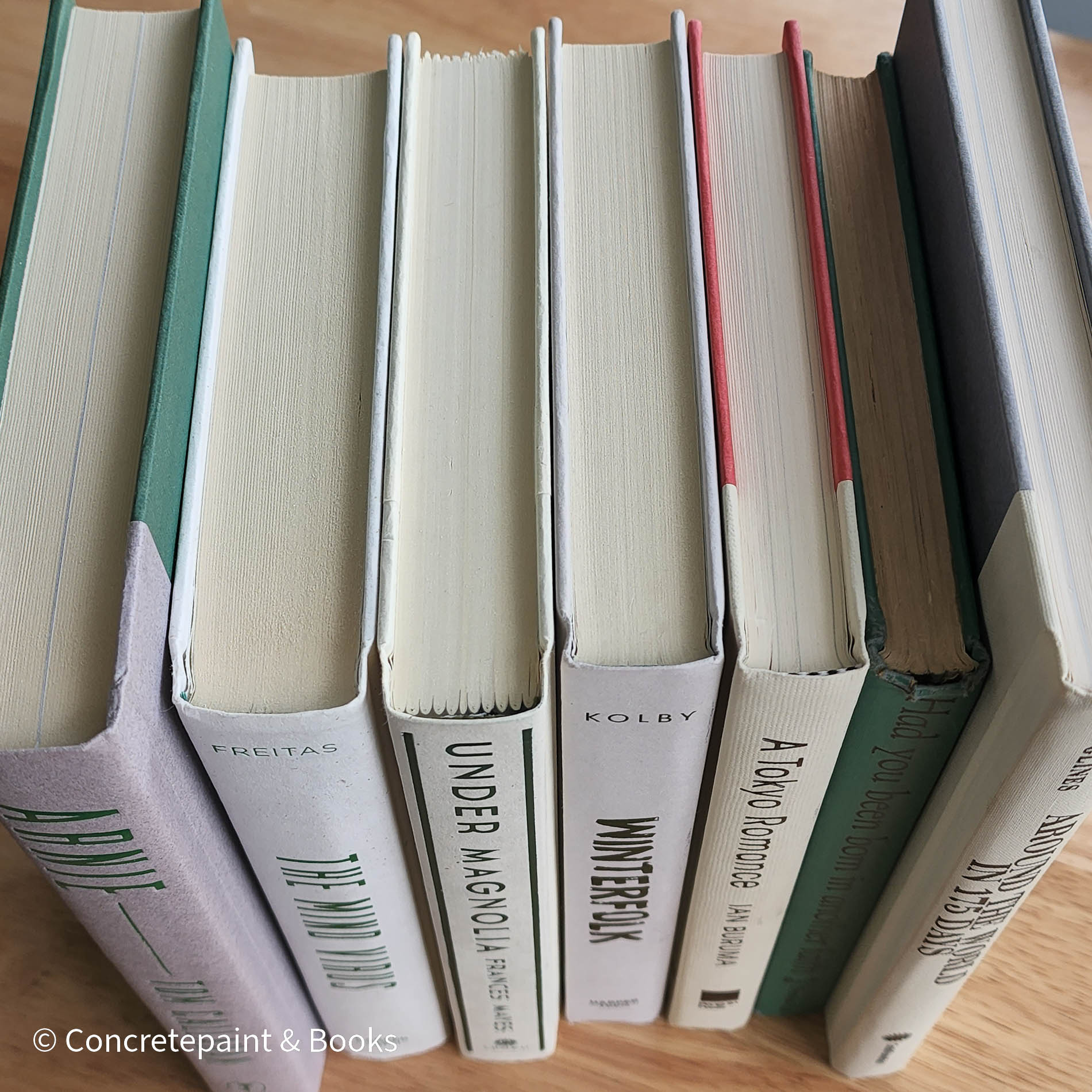 Green neutral and gray real hardcover book stack used for decoration.