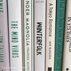 Green neutral and gray real hardcover book stack used for decoration.