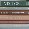 Green and brown books used for shelf decor. 