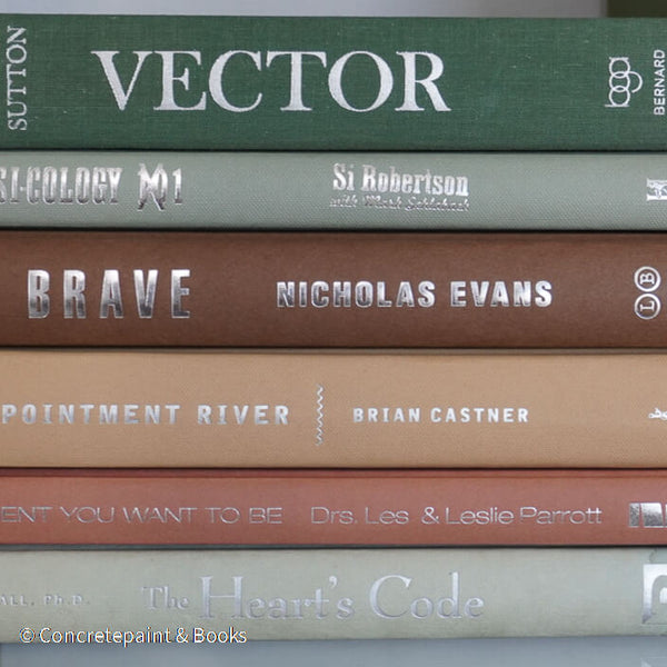 Green and brown books used for shelf decor. 