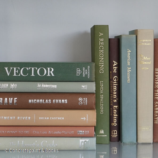 Green and brown books used for shelf decor. 