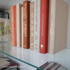 Books for display on shelf. Neutral and warm toned home decor. 