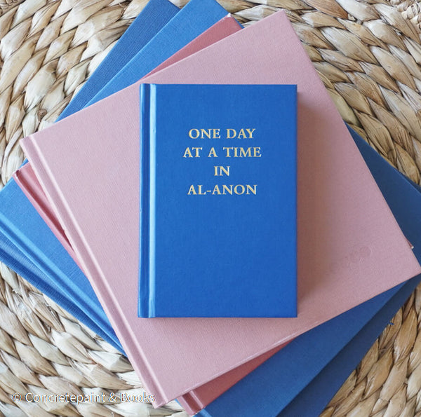 Navy blue and terra-cotta colored books. Decorative books for display. 