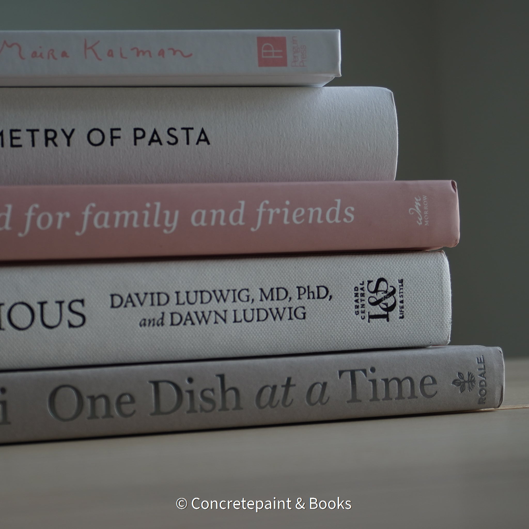 Stack of hardcover books used to decorate. Blush and neutral display books.