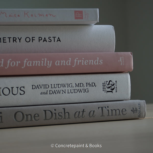 Stack of hardcover books used to decorate. Blush and neutral display books.