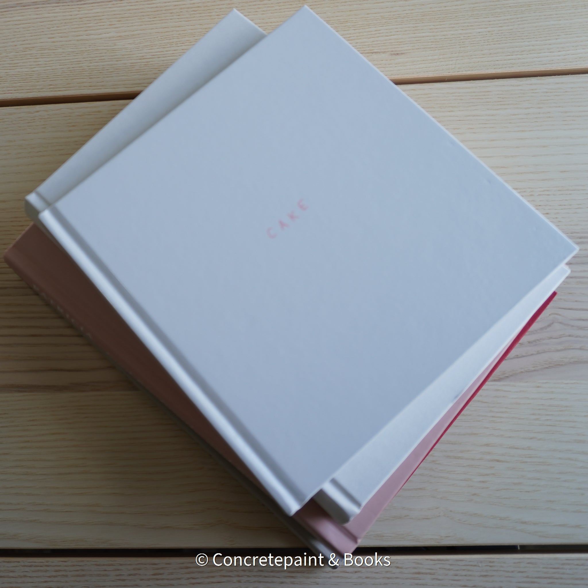 Stack of hardcover books used to decorate. Blush and neutral display books.