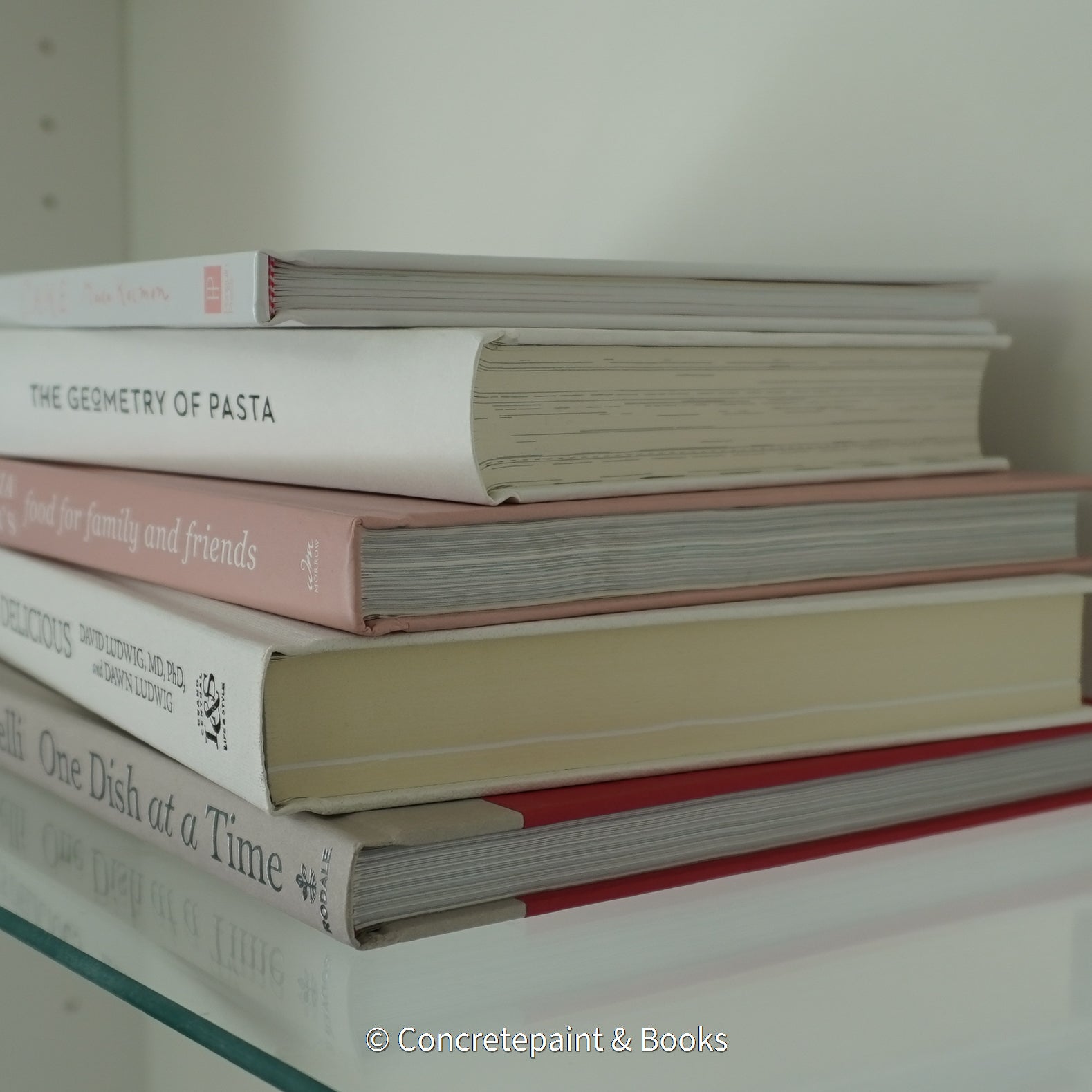 Stack of hardcover books used to decorate. Blush and neutral display books.
