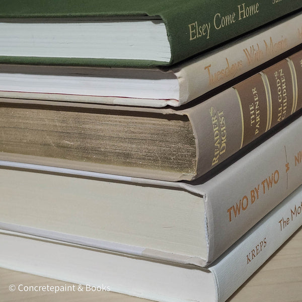 Olive green and neutral books used as shelf decor. Set of books for reading and decorating.