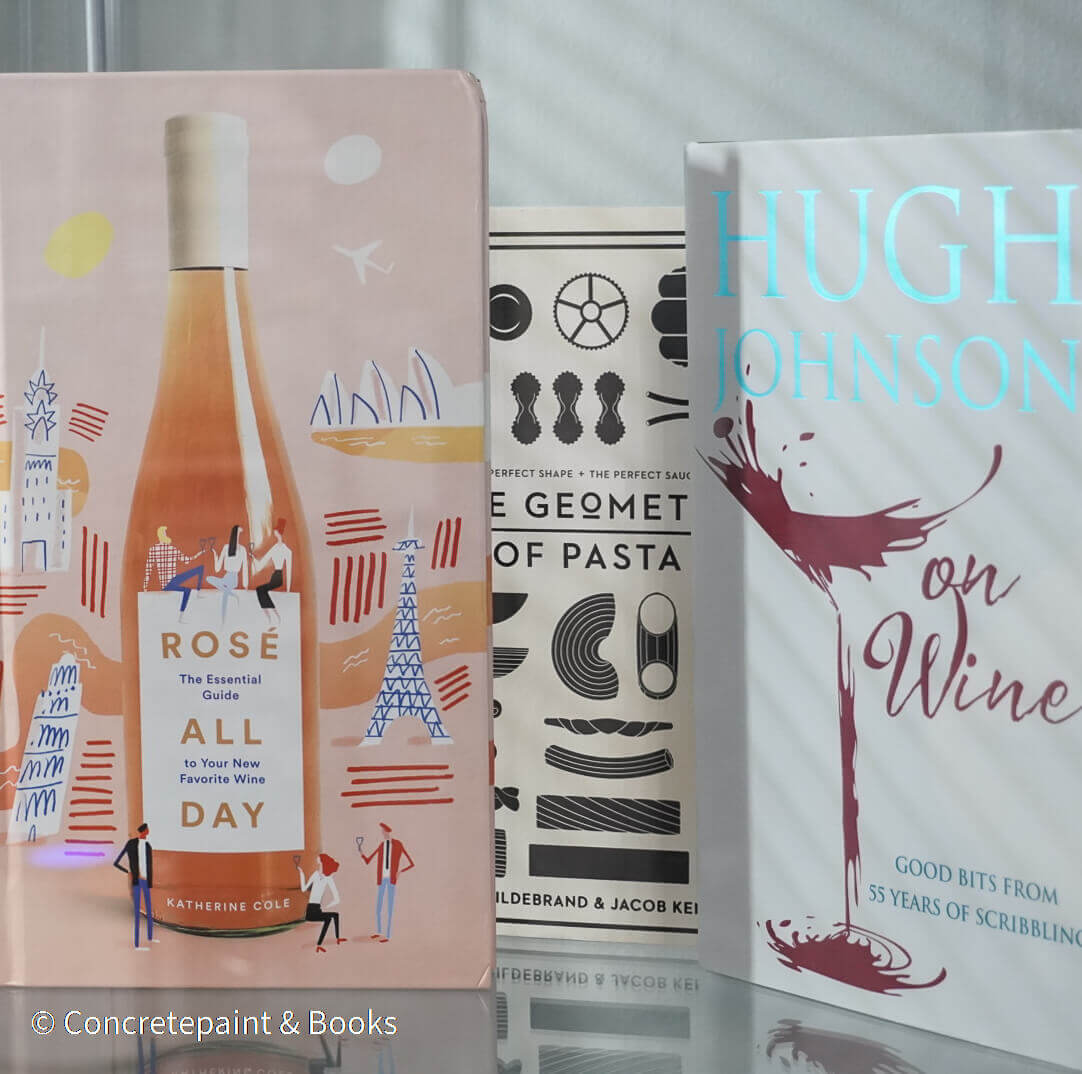 Set of decorative books for display. Real hardcover books in white, blush, and silver purple used for decorating. Decorative cookbook, cocktail book, and coffee table book.