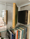 neutral, black, white and gold kitchen decoration. Cookbooks used as kitchen decoration  